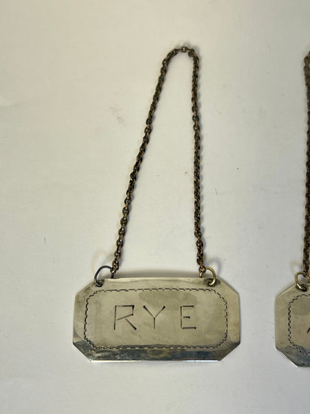 Set of Two American Sterling Silver Rye and Scotch Decanter Labels