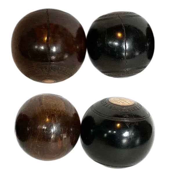 Collection of Four Scottish Thomas Taylor and English Lignum Vitae Lawn Balls