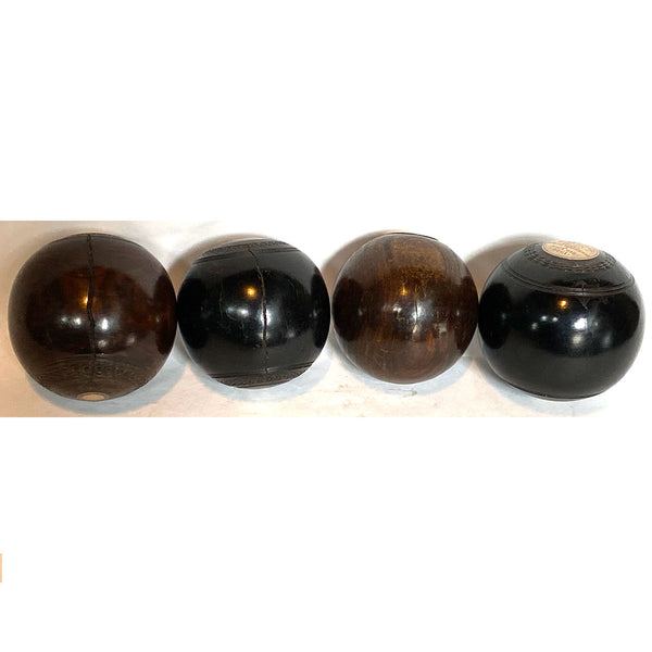 Collection of Four Scottish and English Lignum Vitae Lawn Bowls