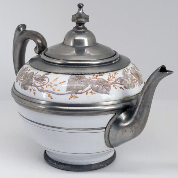 Lot 0388 | American Manning, Bowman & Co. Pewter Enamel Graniteware Tea and Coffee Pots (3 pieces)