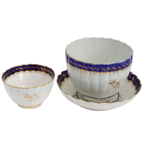 Three English Caughley Gilt and Cobalt Porcelain Fluted Tea Bowls and Saucer