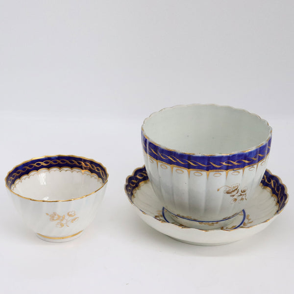 Three English Caughley Gilt and Cobalt Porcelain Fluted Tea Bowls and Saucer