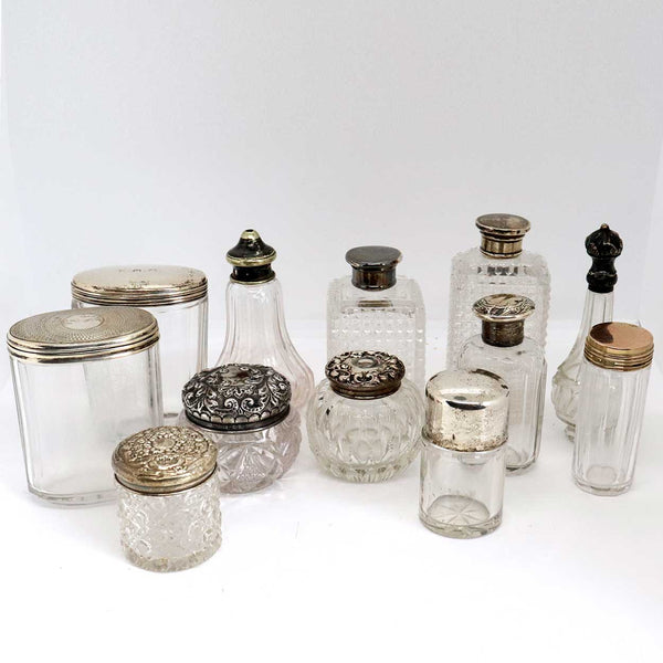 Collection of 12 American and English Sterling Silver and Glass Dresser Vanity Bottles