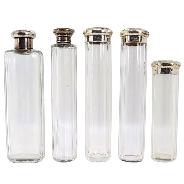 Five English and German Sterling Silver Mounted Slab Cut Glass Vanity Case Bottles